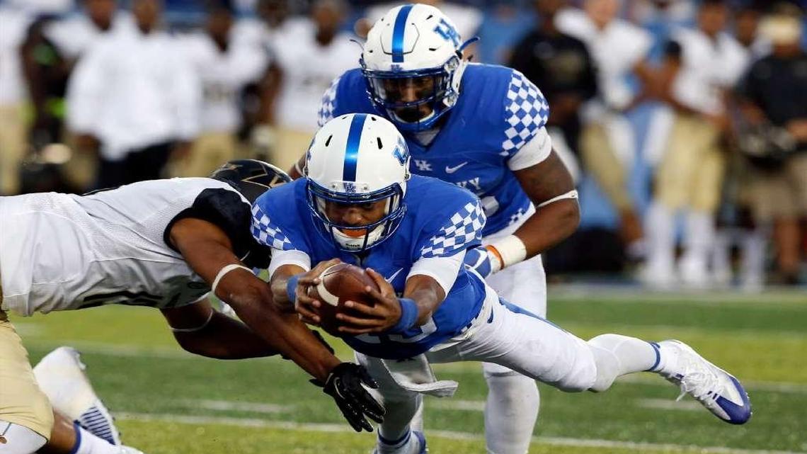 Kentucky quarterback Stephen Johnson II dived for a first down on a 4th-and-1 play late in the Wildcats’ 20-13 victory over Vanderbilt.