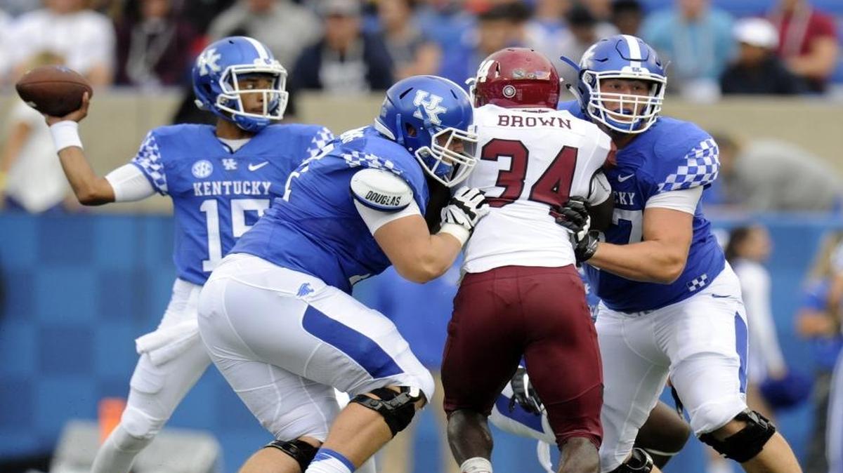 UK LG Logan Stenberg and LT Landon Young block for QB Stephen Johnson during the 2nd quarter of the University of Kentucky-New Mexico State football game at Commonwealth Stadium on Sept. 17, 2016.