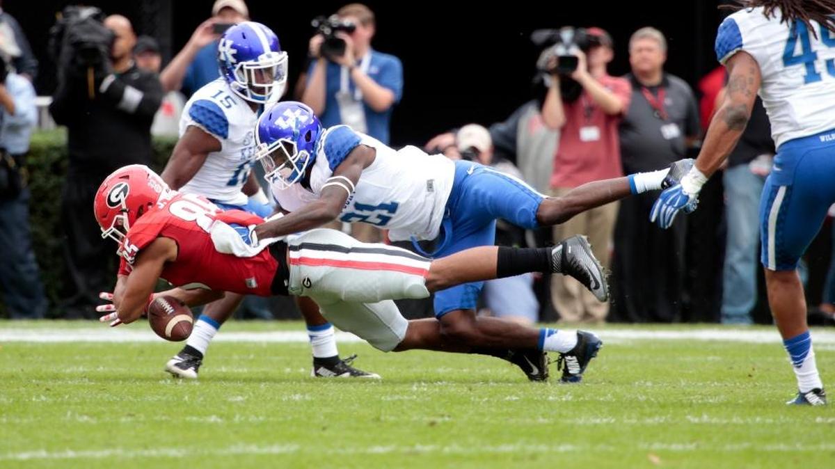 Kentucky defensive back Chris Westry knocked the ball loose from Georgia tight end Jordan Davis during last season’s game in Athens, Ga.