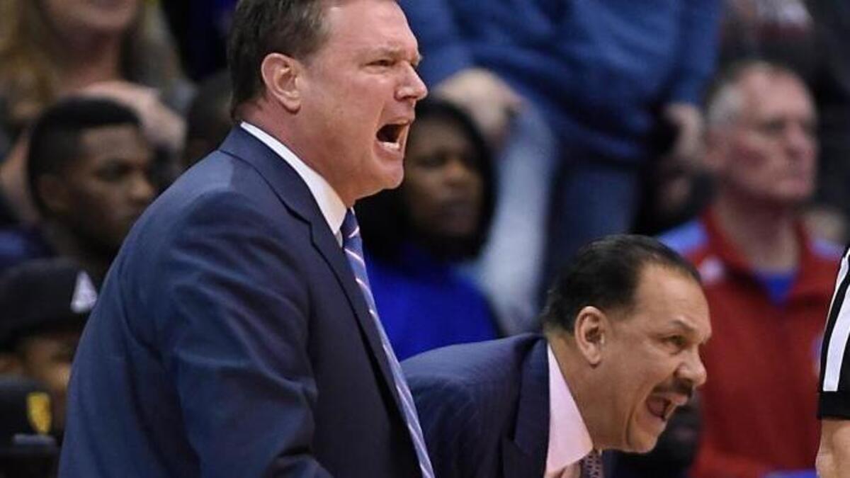 Kansas assistant men’s basketball coach Kurtis Townsend, right, with Jayhawks head coach Bill Self, is now among the central figures in the Adidas trial.