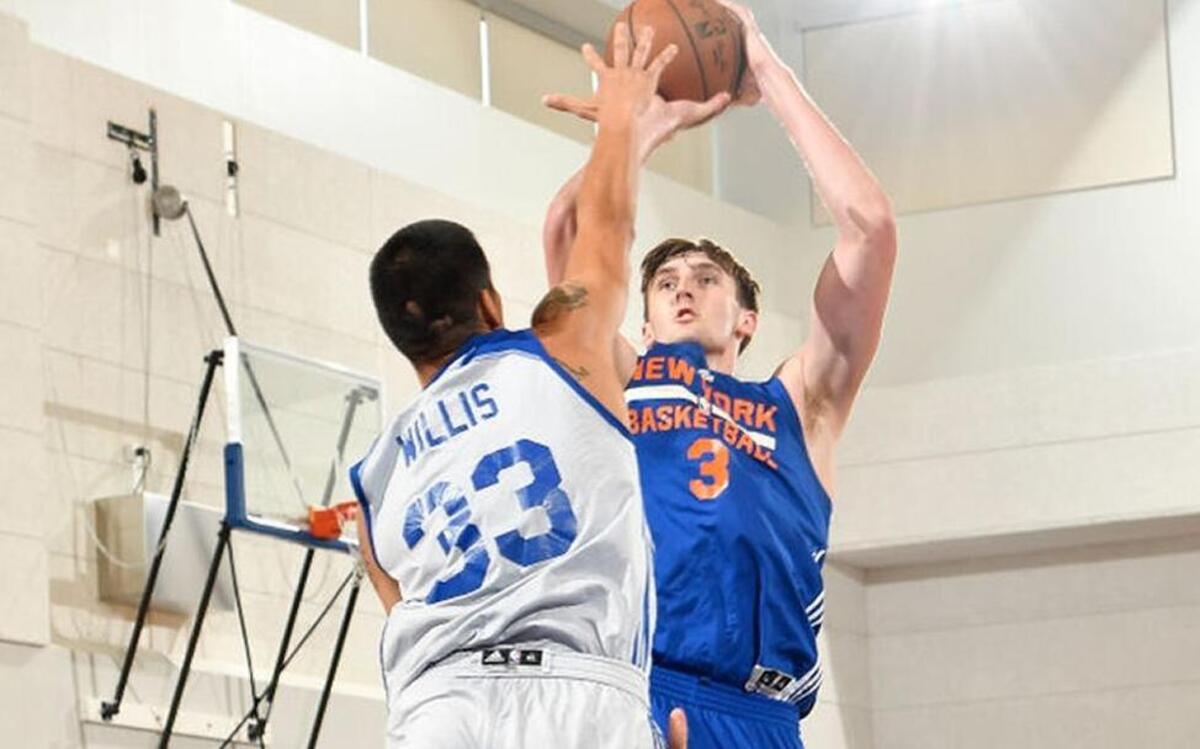 Luke Kornet, right, took a shot over former Kentucky standout Derek Willis during an NBA summer league game in Orlando, Fla., on Sunday.