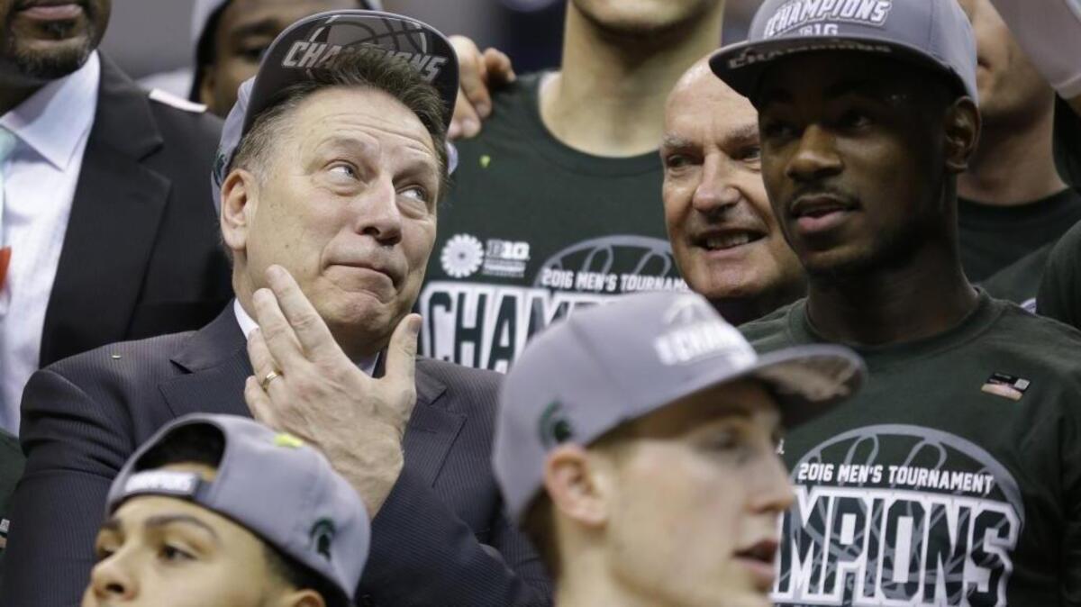 Michigan State's head coach Tom Izzo celebrates with his players after an NCAA college basketball game against Purdue in the finals at the Big Ten Conference tournament, Sunday, March 13, 2016, in Indianapolis. Michigan State won 66-62.