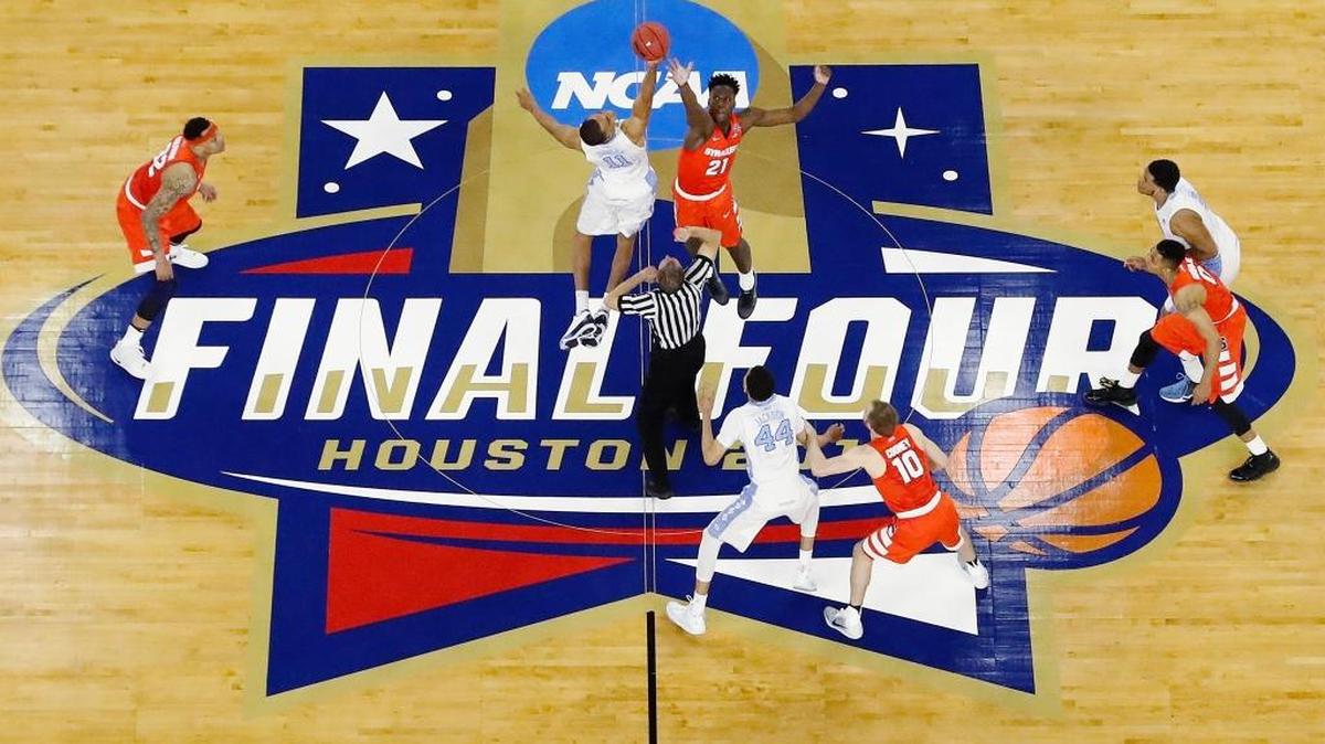 Syracuse forward Tyler Roberson (21) and North Carolina forward Brice Johnson (11) tipped the ball off during the 2016 NCAA Final Four in Houston.