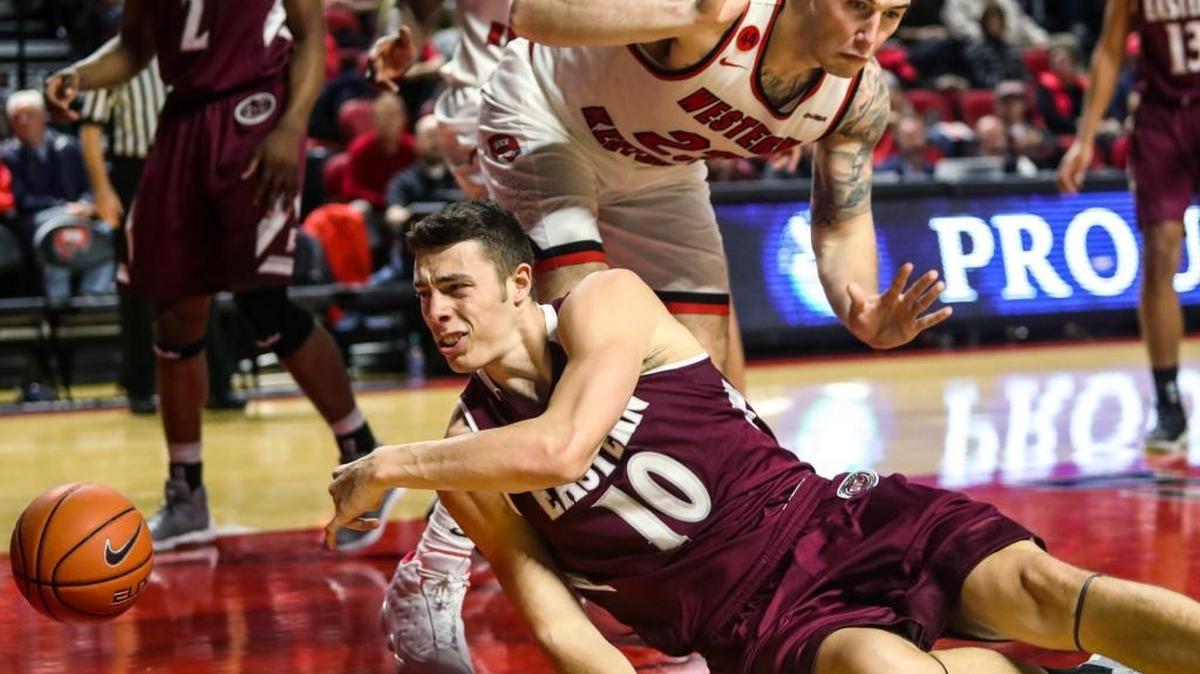 Western Kentucky forward Justin Johnson (23) was called for a foul after colliding with Eastern Kentucky forward Nick Mayo (10) during an NCAA college basketball game in Bowling Green, Ky., Wednesday, Nov. 29, 2017.