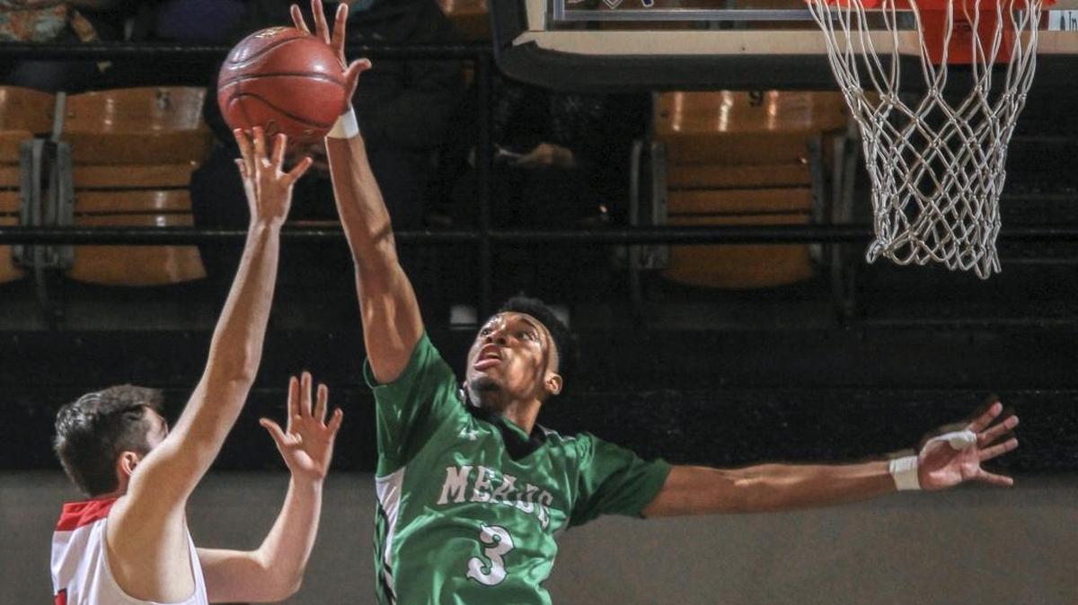 Meade County’s James Baker blocked a shot by Edmonson County’s J. T. Vincent during the 2016-17 season. Baker has signed with Morehead State.
