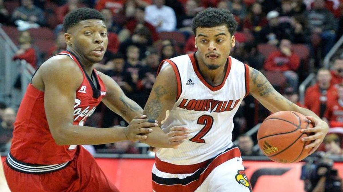 Louisville’s Quentin Snider (2) tried to drive past Western Kentucky’s Chris McNeal during the second half Saturday in Louisville.