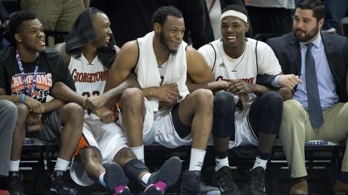 Georgetown players celebrated watched as the final seconds ticked off the clock as Georgetown defeated Mid-America Nazarene, 90-83 during the 2016 NAIA Tournament semi-finals held Monday, March 21, 2016, at Municipal Auditorium in Kansas City.