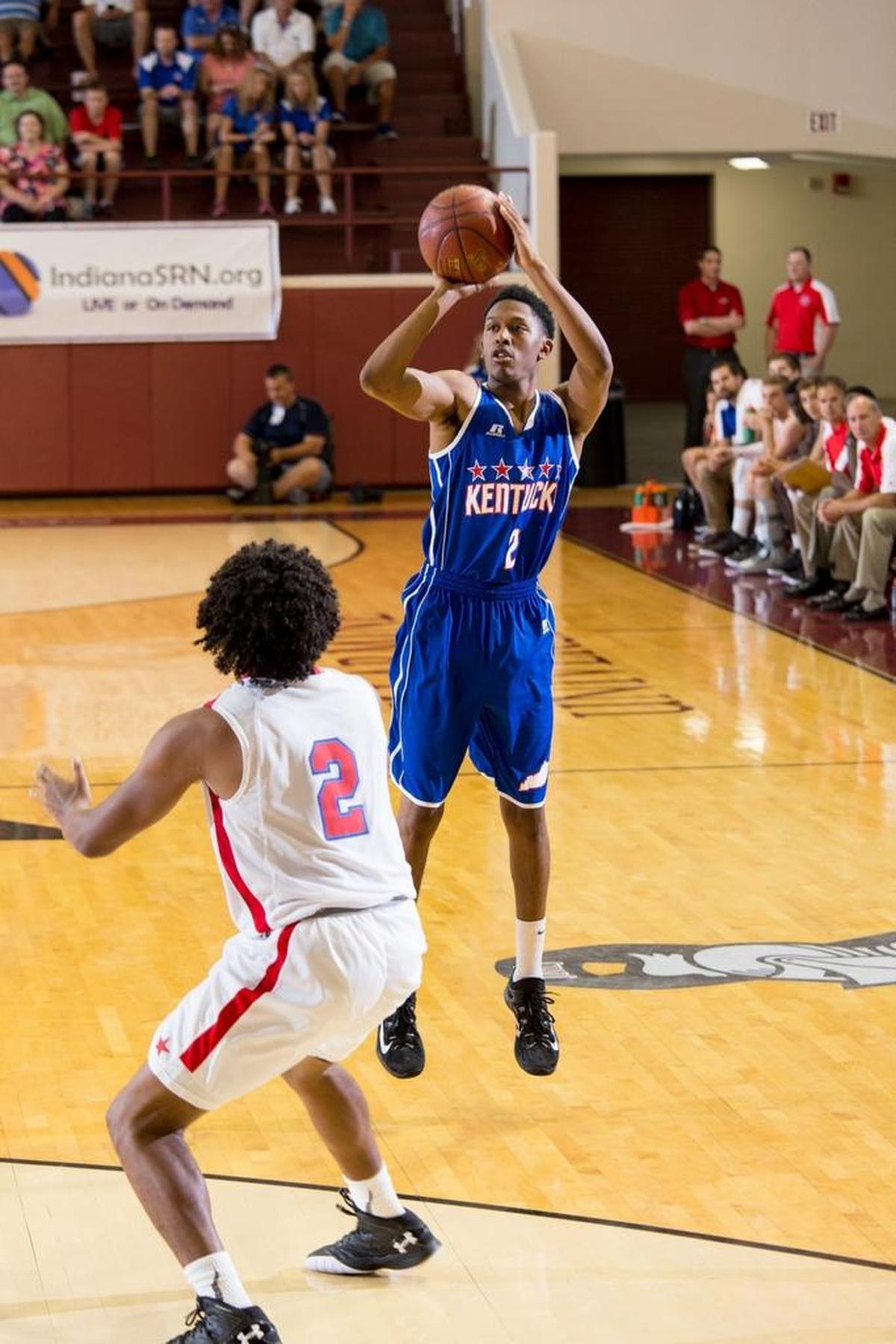 Kentucky Boys All-Star Mason Faulkner, right shoots a three point basket in the second half. Faulkner finished the game with 21 points. The Kentucky vs. Indiana All-Star Classic was held, Sunday, June 12, 2016 at Bellarmine University's Knights Hall in Louisville.