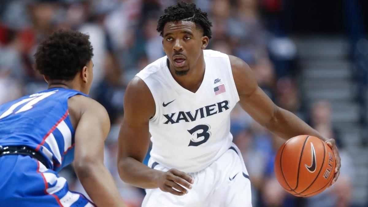 Xavier's Quentin Goodin (3) looked to pass around DePaul's Eli Cain (11) in the second half Wednesday, Feb. 8, 2017, in Cincinnati. Xavier won 72-61.