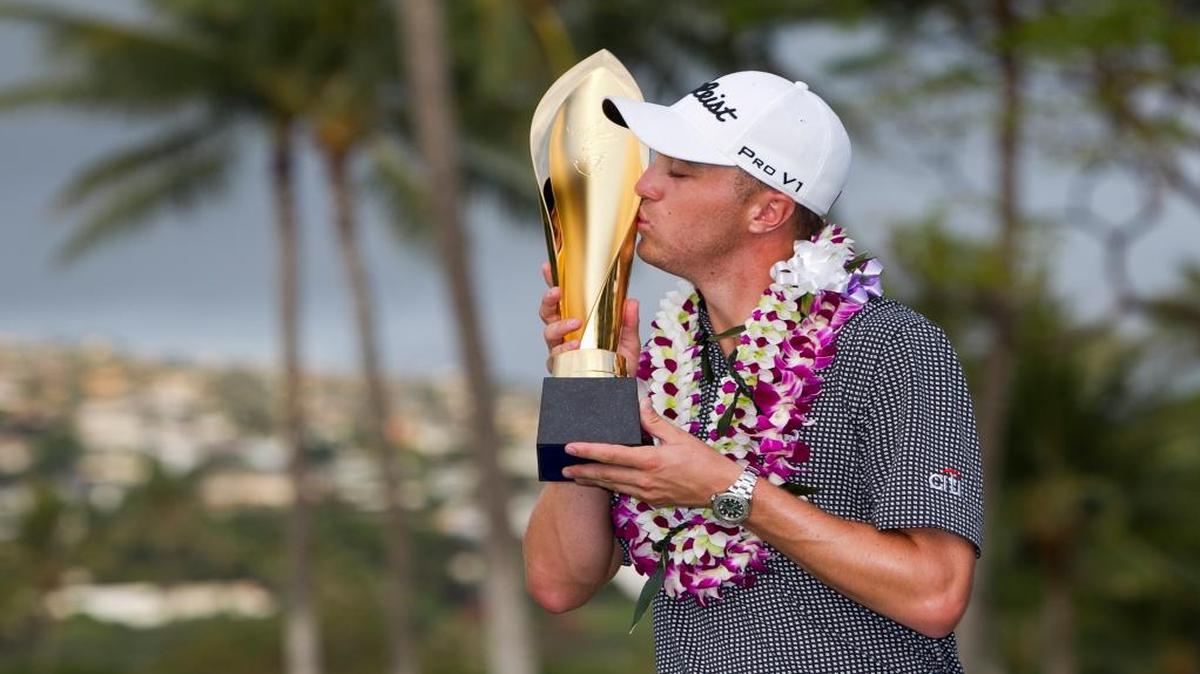 Justin Thomas kissed the trophy after winning the Sony Open golf tournament Sunday in Honolulu.