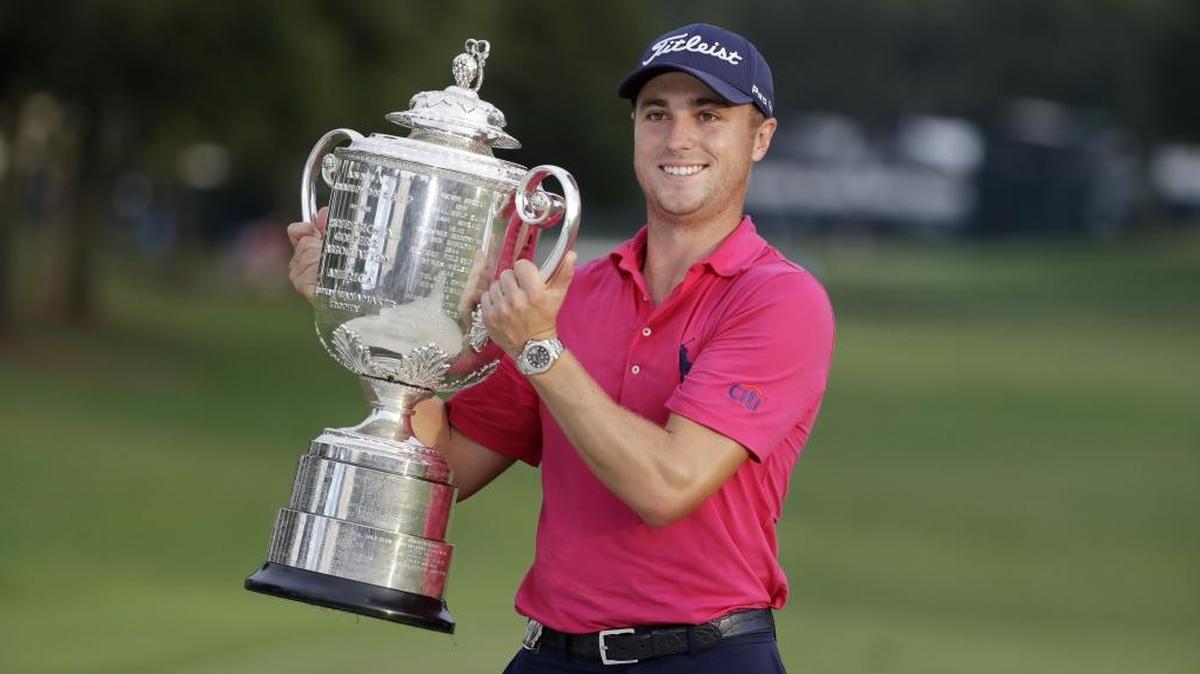 Louisville native Justin Thomas posed with the Wanamaker Trophy after winning the 2017 PGA Championship golf tournament at the Quail Hollow Club in Charlotte, N.C., in August. The PGA Championship will be played in Louisville in 2024, the PGA of America announced Thursday.