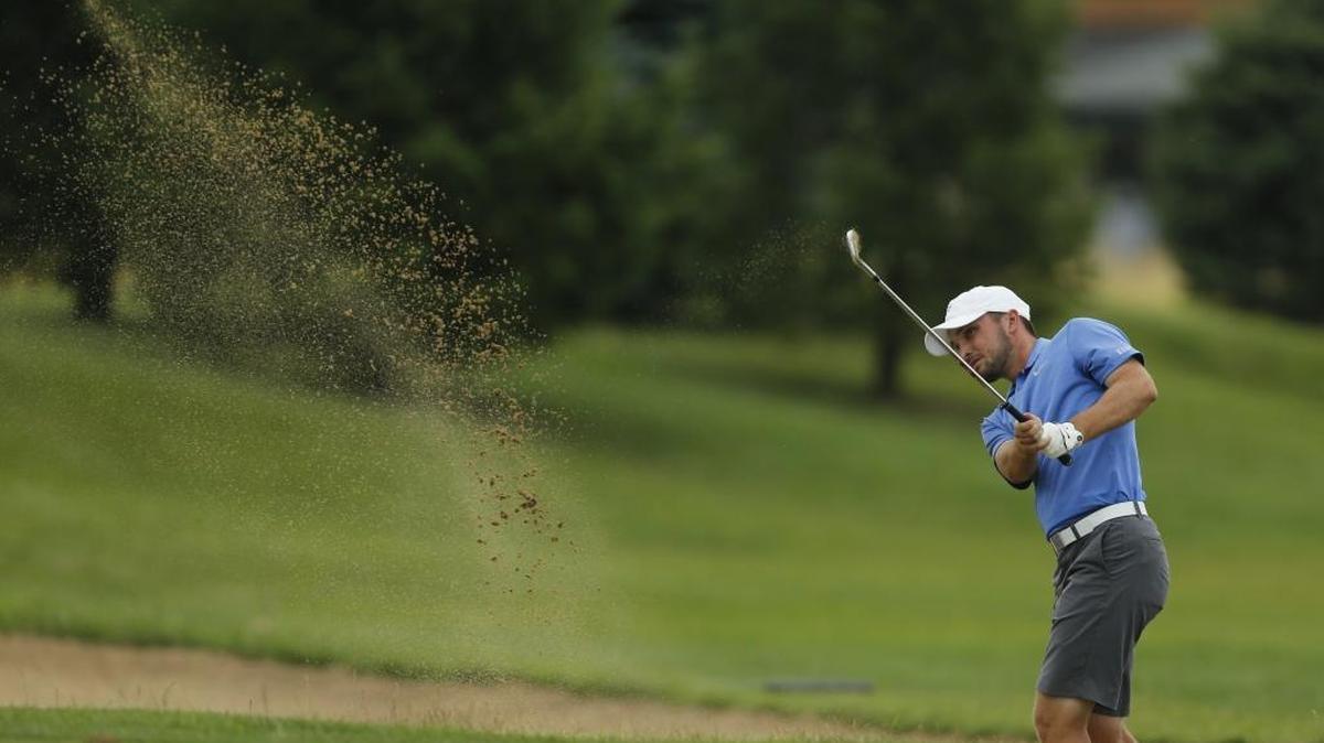 Wildcat Tyler “Chip” McDaniel hit out of the bunker on the tenth hole during the final round of the Kentucky Men's Amateur Tournament at Nicholasville’s Keene Trace Golf Club. He shot a 1-under 71 on Thursday to capture his second State Am championship and finish with a 15-under 201.