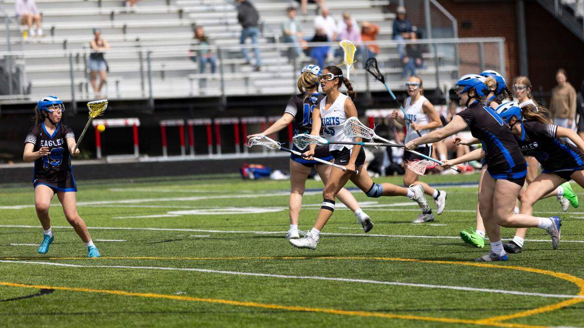 Lexington Catholic’s Poppy Karthikeyan (45) fires a shot on a fast break down the field for a first-half goal against Lexington Christian.