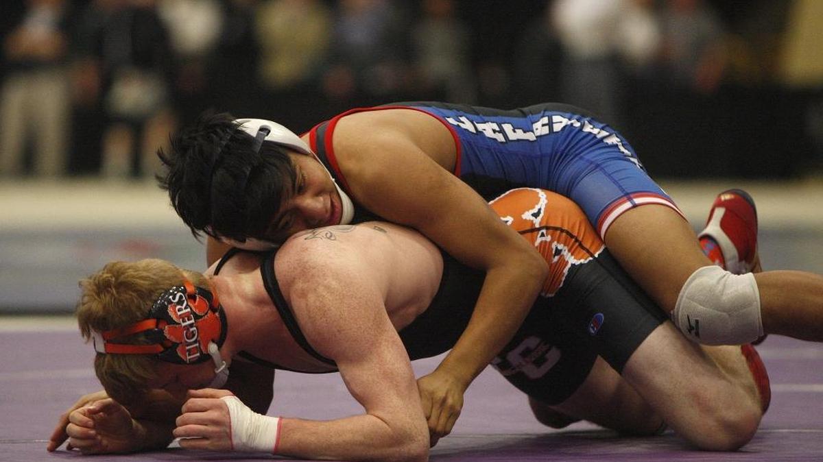 Lafayette's Angel Vasquez wrestles Fern Creek's A. J. Binder in the 138-lb class at the KHSAA State Wrestling Championships at Alltech Arena in Lexington, Ky., Saturday, February 20, 2016.