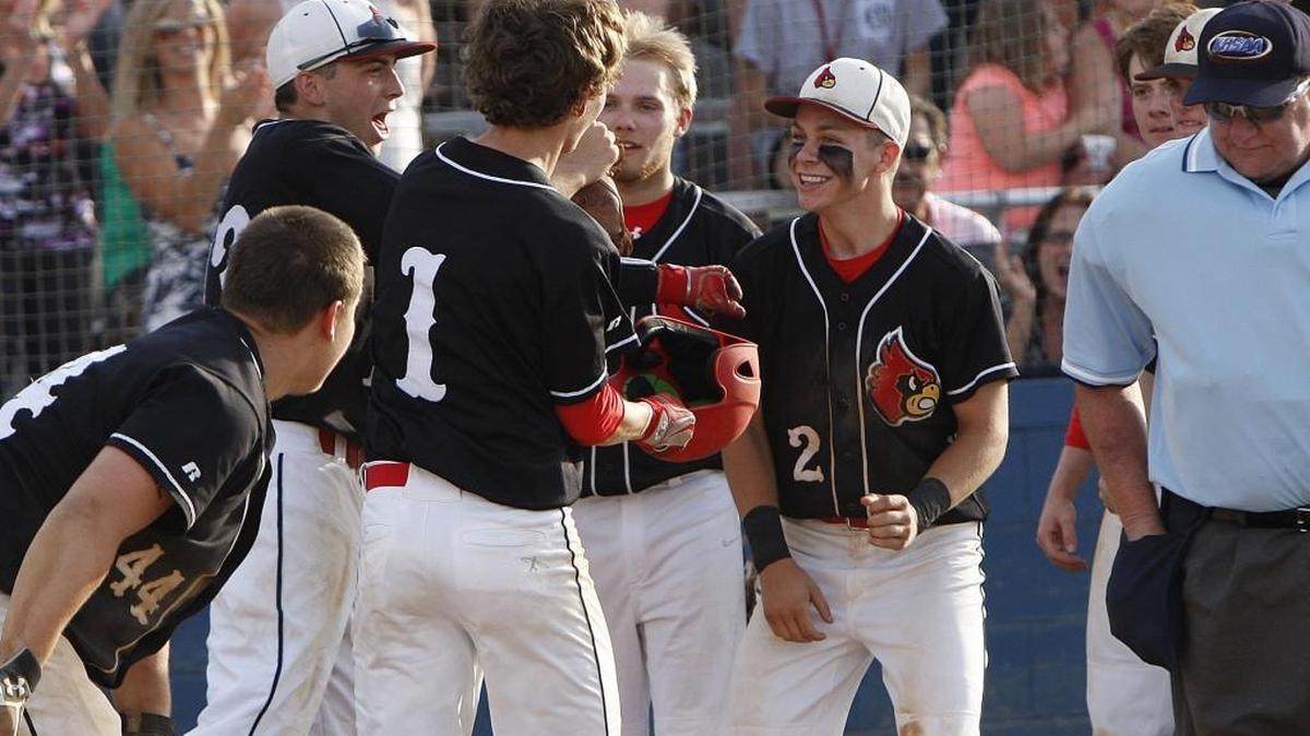 Scott County’s Ryan Hannabach celebrated with teammates following his two-run homer in the sixth inning against Lexington Catholic.