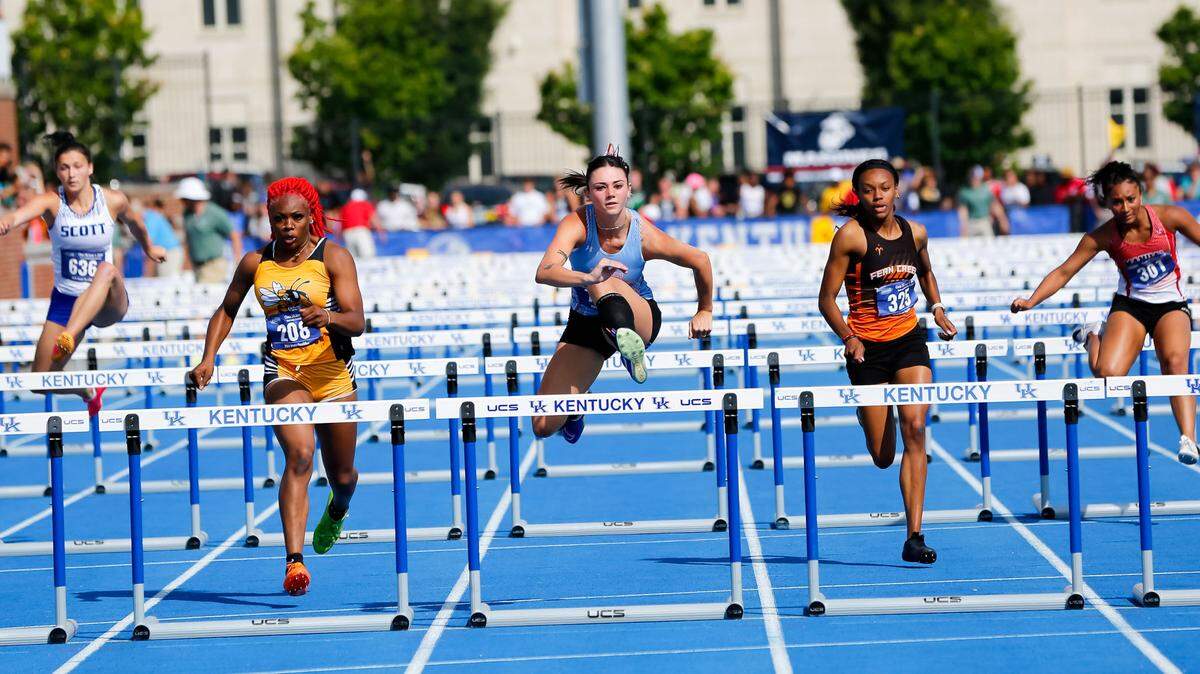 West Jessamine’s Aly Doyle, center, won her second consecutive 100-meter hurdles state title.