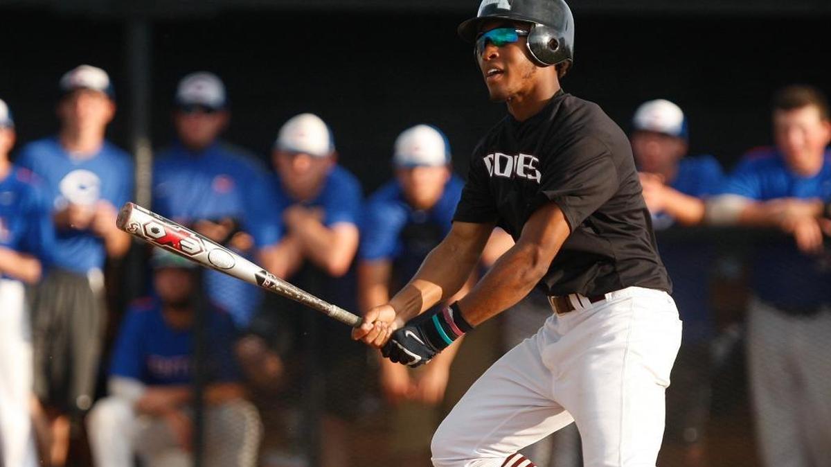 Tates Creek's Jaren Shelby watches his double in the second inning against Madison Central in the 11th region baseball championship at Western Hills high school in Frankfort, Ky., May 29, 2014.