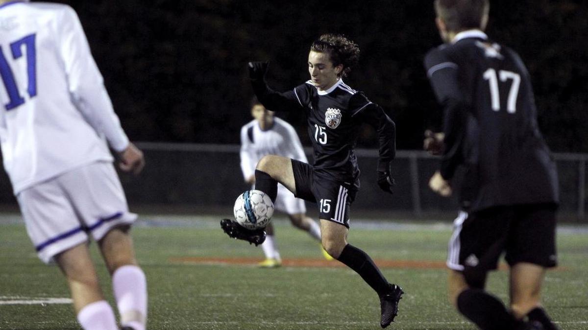 Ryle's Adam Arellano moves the ball against Lexington Catholic in the boys' soccer state semi-round at Joseph K. Ford Stadium in Lexington, Ky., Monday, October 23, 2017.