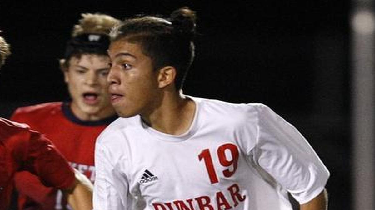 Paul Laurence Dunbar's Pedro Jimenez dribbles against Lafayette's Riley Bishop, left, at Jon Akers Stadium, Ky., Tuesday, September 20, 2016.