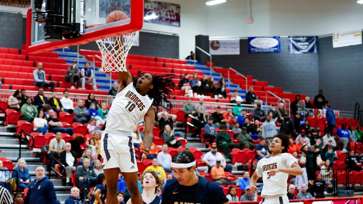 Frederick Douglass forward Aveion Chenault goes up for a fast-break slam during the Broncos’ 77-56 win over Sayre during the 42nd District semifinals at Scott County High School’s Billy Hicks Gymnasium in Georgetown on Tuesday.
