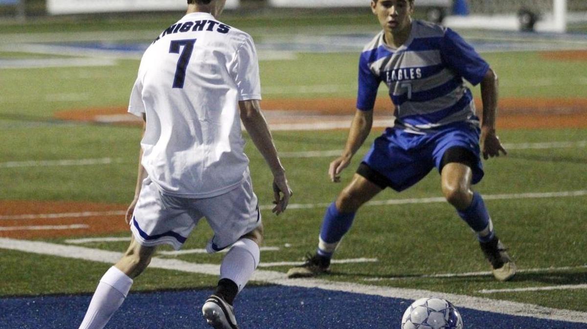 Austin Fields, left, taking on LCA’s Carter Johnson as Lexington Catholic played LCA at home on Thursday September 8, 2016.