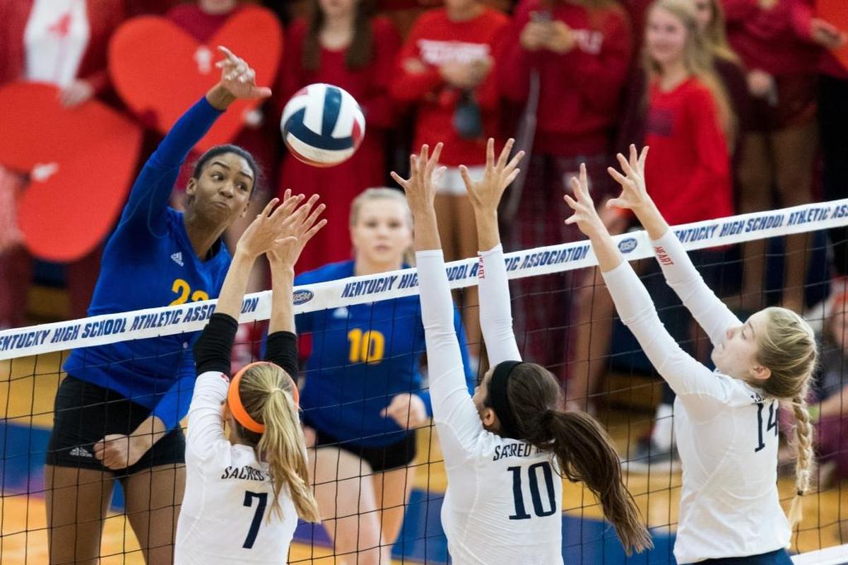 Henry Clay’s Kaitlyn Hord, left, spiked the ball during the Blue Devils’ match against Sacred Heart in the 2016 KHSAA State Volleyball Championship finals at Valley High School in Louisville. Hord, one of the top recruits Lexington has produced, now plays for national college power Penn State.
