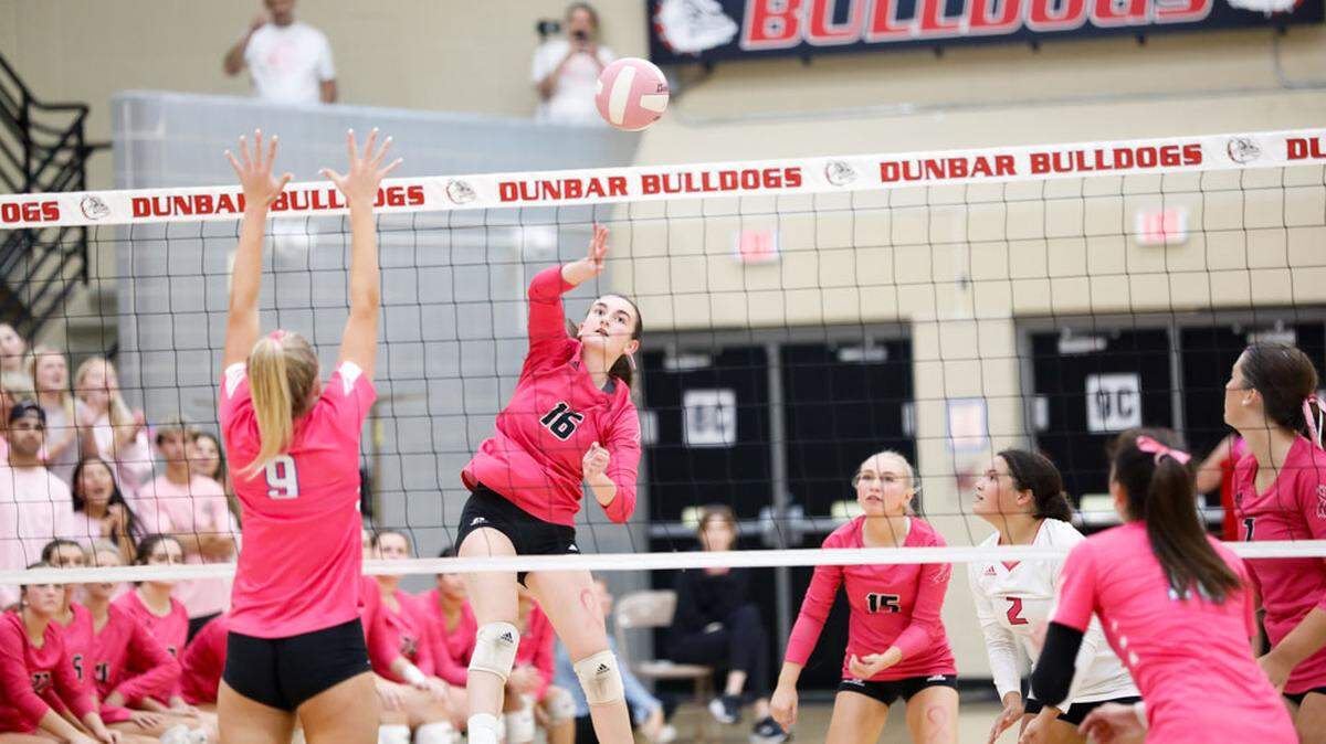 Paul Laurence Dunbar’s Rania Jundi (16) attacks at the net against Lexington Catholic during their volleyball match at Paul Laurence Dunbar High School on Tuesday.