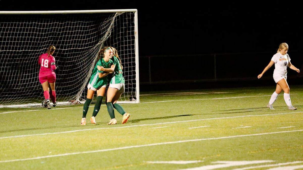 Frederick Douglass’s Ellie Majors, right, hugs teammate Ella Flynn after Flynn’s go-ahead goal in the Broncos’ 2-1 win over defending state champion Bethlehem.