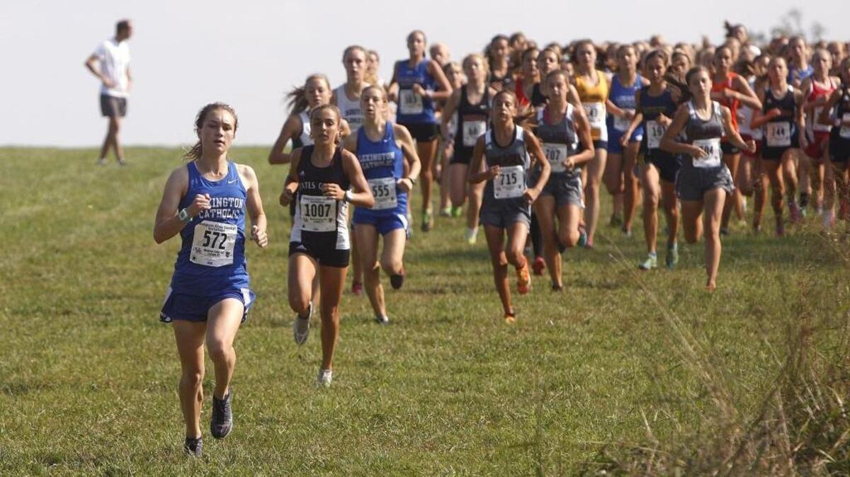 Lexington Catholic's Michaela Reinhart takes command early before winning the varsity girls 5k at the Bluegrass Cross Country Invitational at Masterson Station Park in Lexington, Ky., Saturday, September 10, 2016.