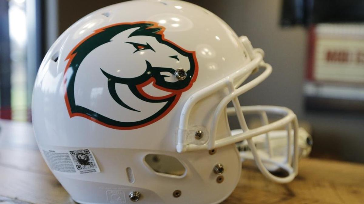 A football helmet on display with Frederick Douglass' mascot and colors, a stallion in Keeneland Green and orange at Mod Pizza and Frederick Douglass High School in Lexington, Ky., on Jan. 2, 2017. Principal Lester Diaz introduced Brian Landis as the first football coach for the school. Also announced was the mascot, a stallion and school colors, Keeneland Green and orange.