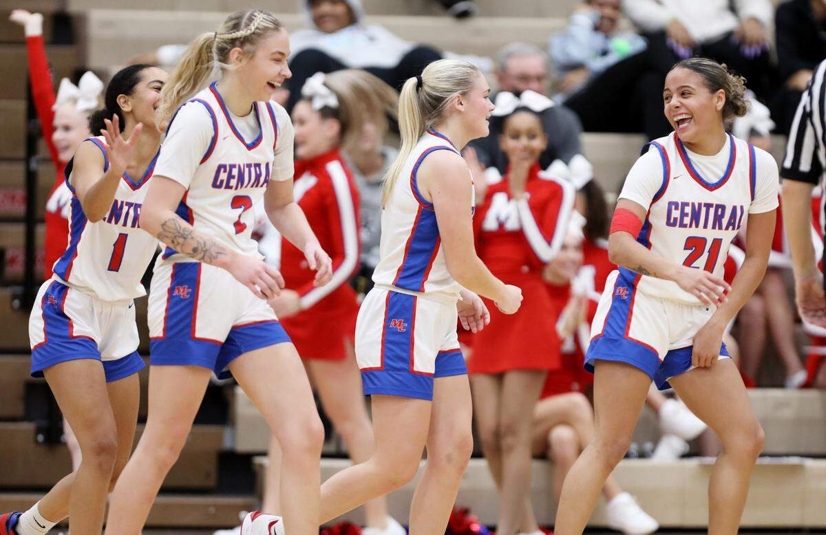 Madison Central celebrates its win over Lafayette in the girls 11th Region Tournament semifinals at Paul Laurence Dunbar High School’s S.T. Roach Sports Center on Thursday.