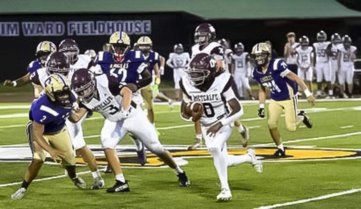 Metcalfe County running back Byron Kirkland-Lundy (0) carries the ball at Campbellsville on Sept. 6. He rushed for a state-record 10 touchdowns against Clinton County on Friday.
