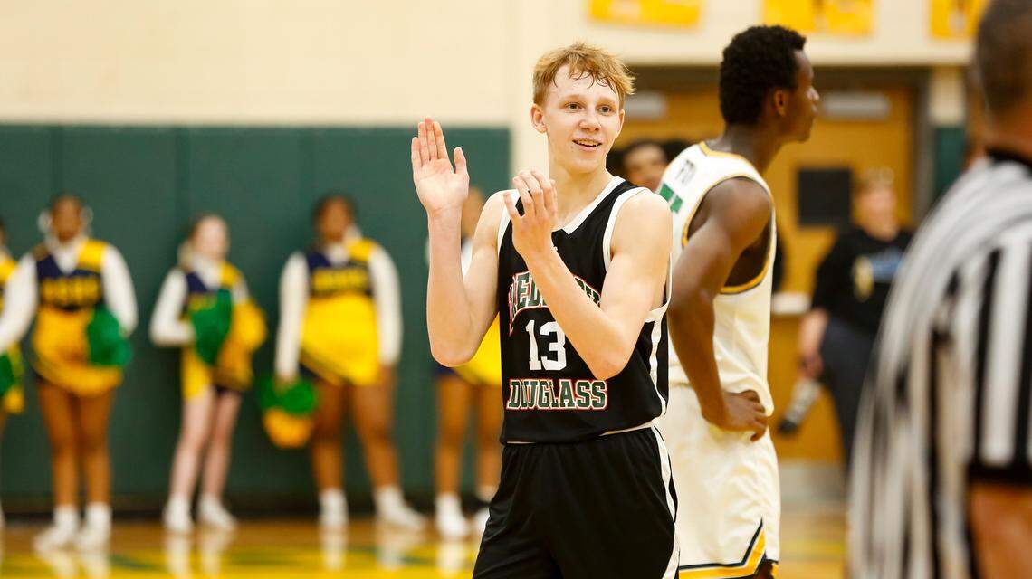 Frederick Douglass guard Tate Robinson applauds after his team appeared to secure a comeback win over Bryan Station at the end of the second half. Moments earlier, Robinson hit a 3-pointer to help Douglass take the lead at Bryan Station High School on Friday.