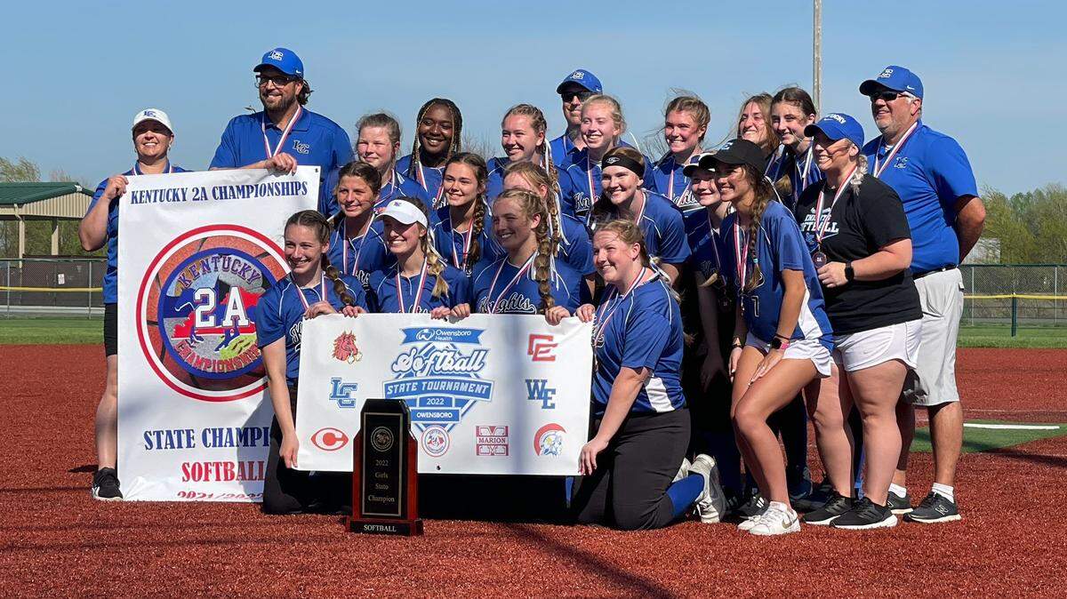 Lexington Catholic’s softball team posed with its Kentucky 2A Championships tournament trophy on Saturday in Owensboro after its defeat of Warren East in the title game.