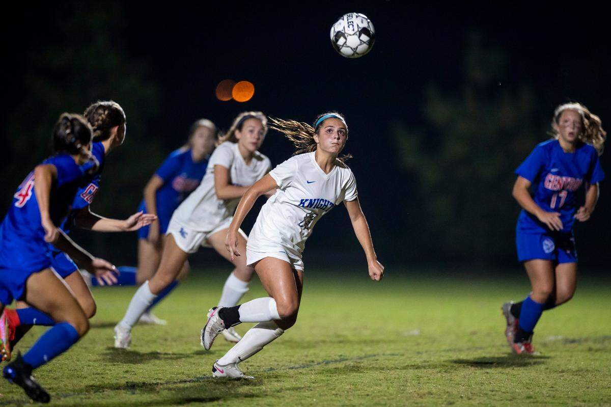 Mary Martin Hampton (13) of Lexington Catholic runs with the ball downfield against Madison Central during last season’s 11th Region Tournament.