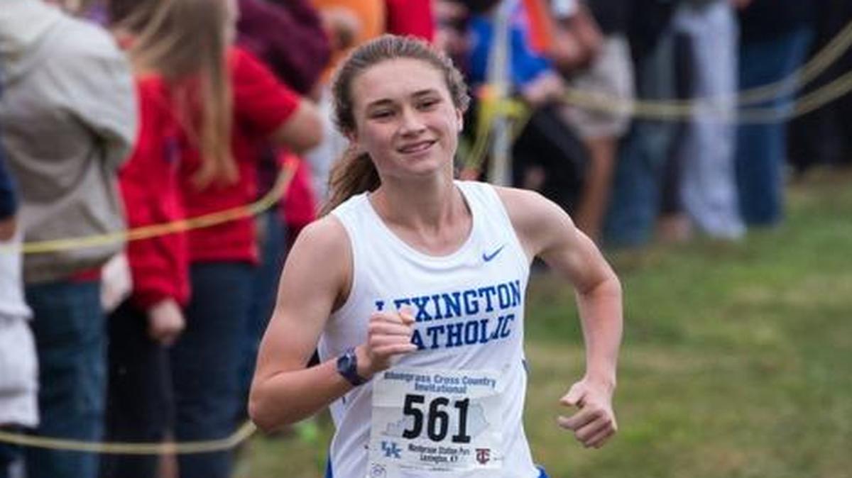 Lexington Catholic's Michaela Reinhart smiled midway as she cruised to victory in 17:49.49 the girls 5K at the UK Tates Creek Bluegrass Cross Country Invitational held at Masterson Station Park in Lexington, Ky. on Saturday September 12, 2015.