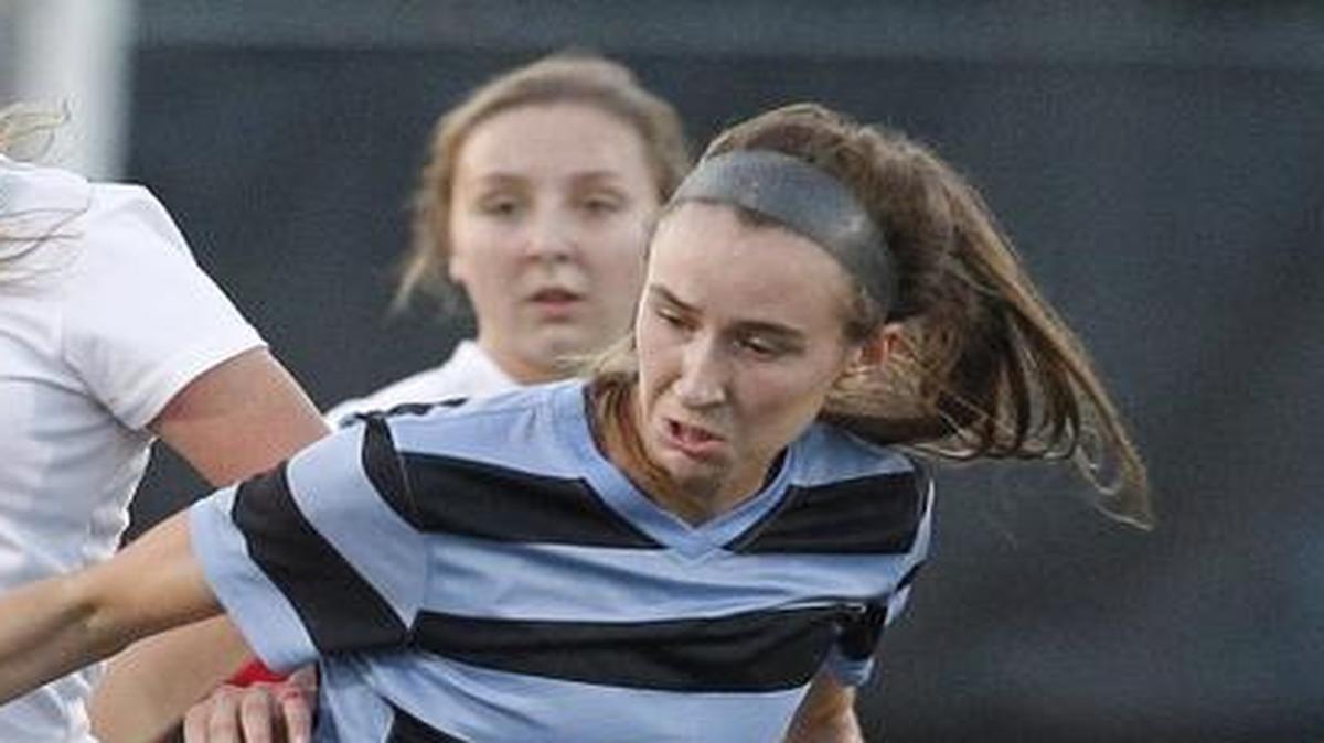 West Jessamine's Eva Mitchell steals the ball from Sacred Heart's Cassie Amshoff during the KHSAA state quarterfinals at Jon R. Akers Stadium in Lexington, Ky., Saturday, October 29, 2016.