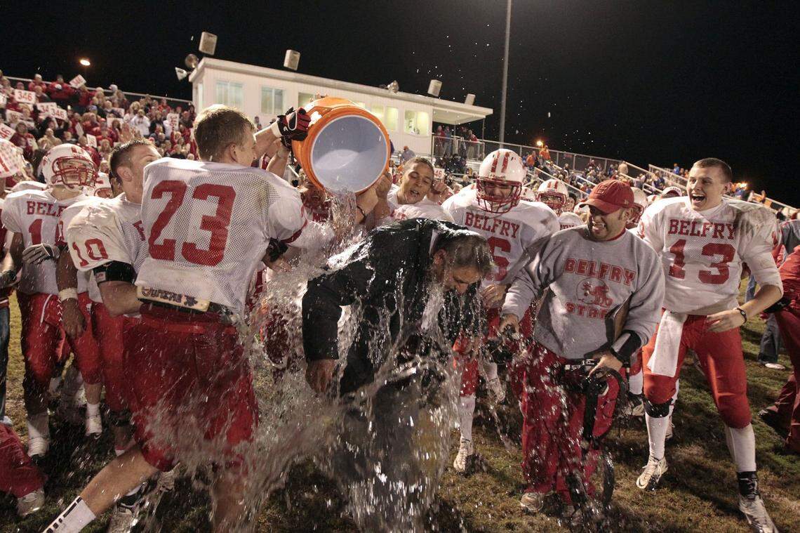 Belfry players dump a celebratory water bucket on Philip Haywood on the night in 2011 when the Pirates head coach won his 346th career game, which made him Kentucky’s winningest high school football coach. Haywood went on to win an additional 145 games before his death Wednesday at age 73.