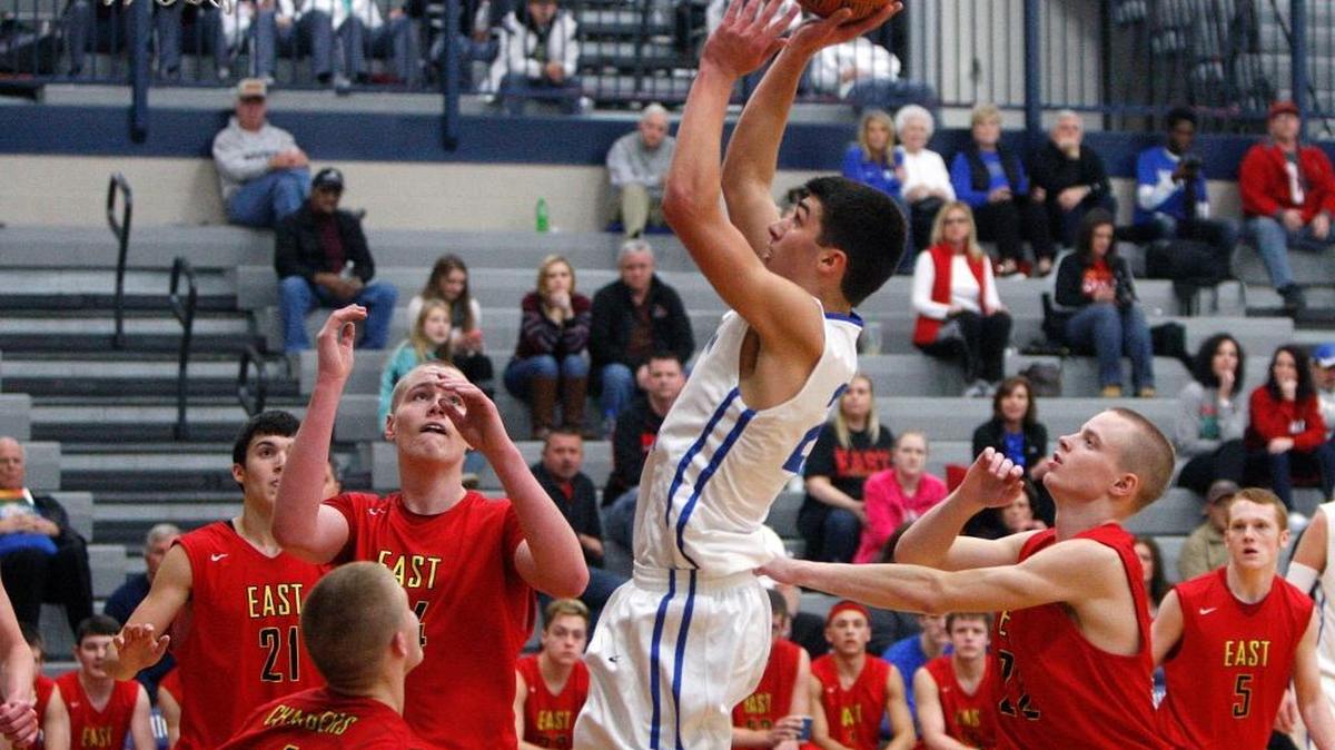 LCA’s Kyle Rode shoots against Bullitt East during the Traditional Bank Holiday Classic in Bueter Gymnasium at Lexington Catholic High School in Lexington, Ky., Saturday, December 27, 2014.