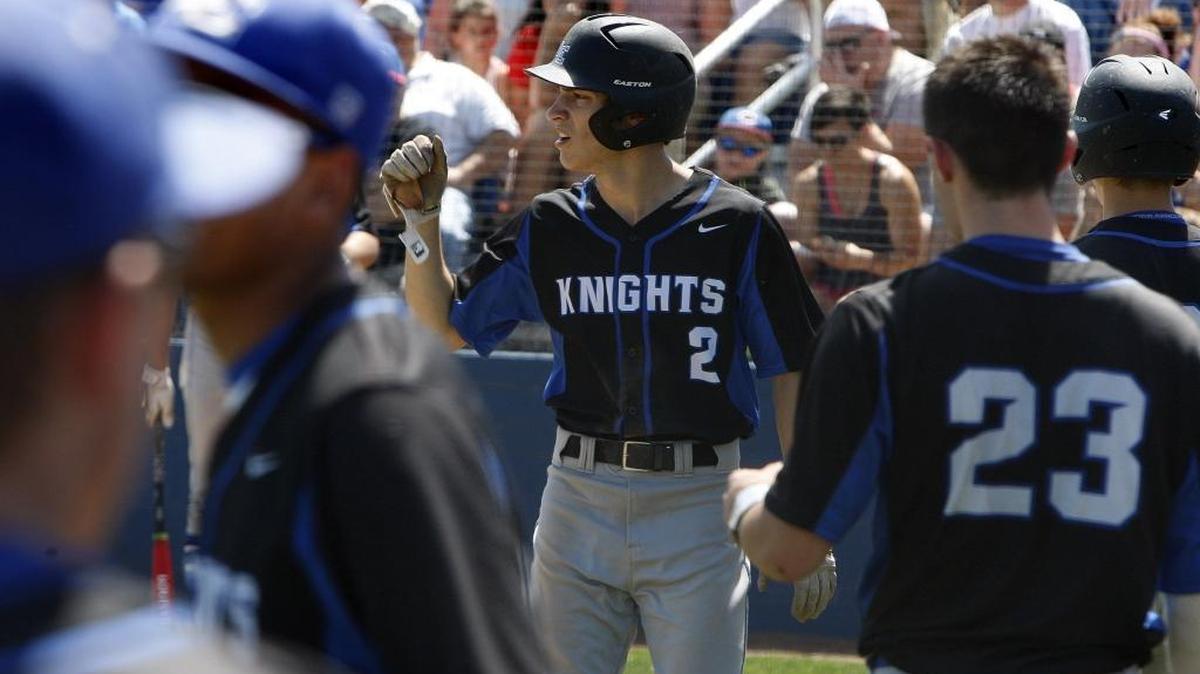 Lexington Catholic’s Andy Thompson pumped his fist at C.J. Bush after scoring on Bush’s double against Madison Central during the first round of the 11th Region baseball tournament in Lexington on Monday, May 30, 2016.