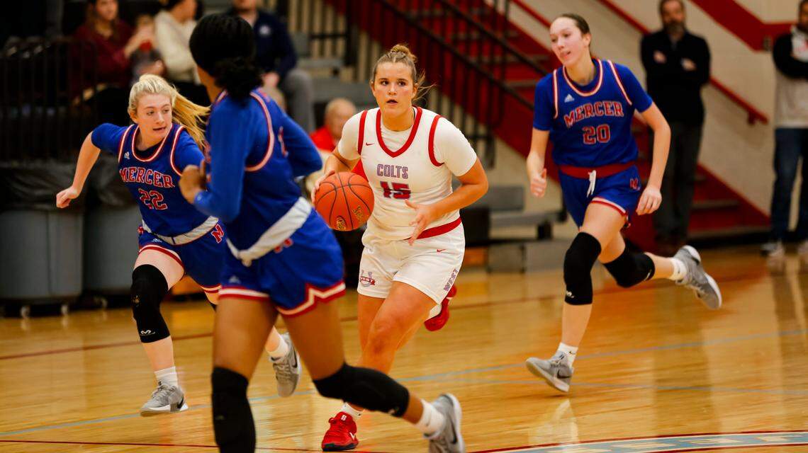 West Jessamine’s Claire Marshall, center, advances the ball with Mercer County’s Reese Ransdell (22) and Izzie Carlton (20) in pursuit during the Colts’ 58-37 win over the Titans at West Jessamine High School in Nicholasville on Jan. 24.
