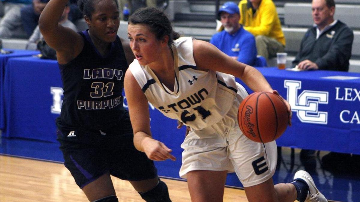Elizabethtown’s Erin Boley drove against Bowling Green’s Dejia Moore in the semifinals of the Traditional Bank Holiday Classic in the Beuter Gymnasium at Lexington Catholic on Tuesday, Dec. 22, 2015.