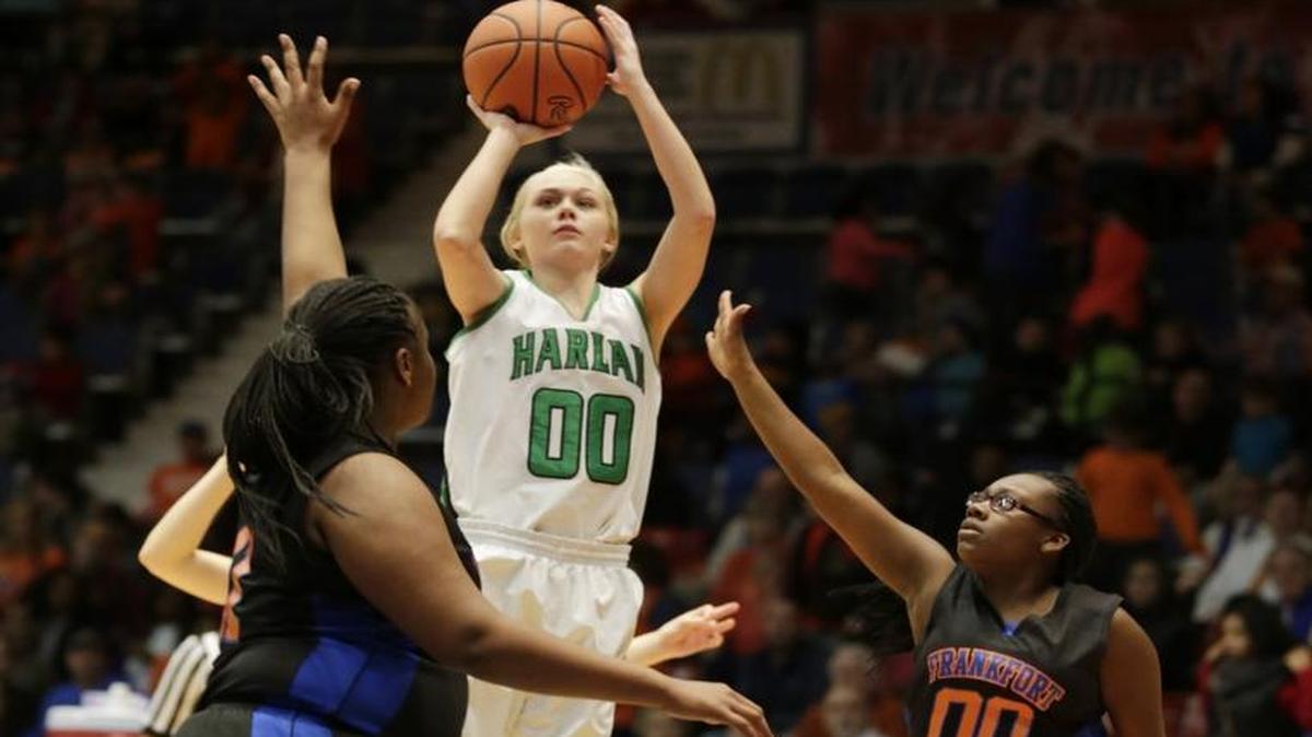 Harlan's Jordan Brock (00) scored while double guarded in the third quarter of the All "A" Classic First quarterfinal girls basketball game between Harlan and Frankfort at the Frankfort Convention Center in Frankfort, Ky, on Jan. 29, 2016. Harlan beat Frankfort 67-50 and will advance to the semifinals.