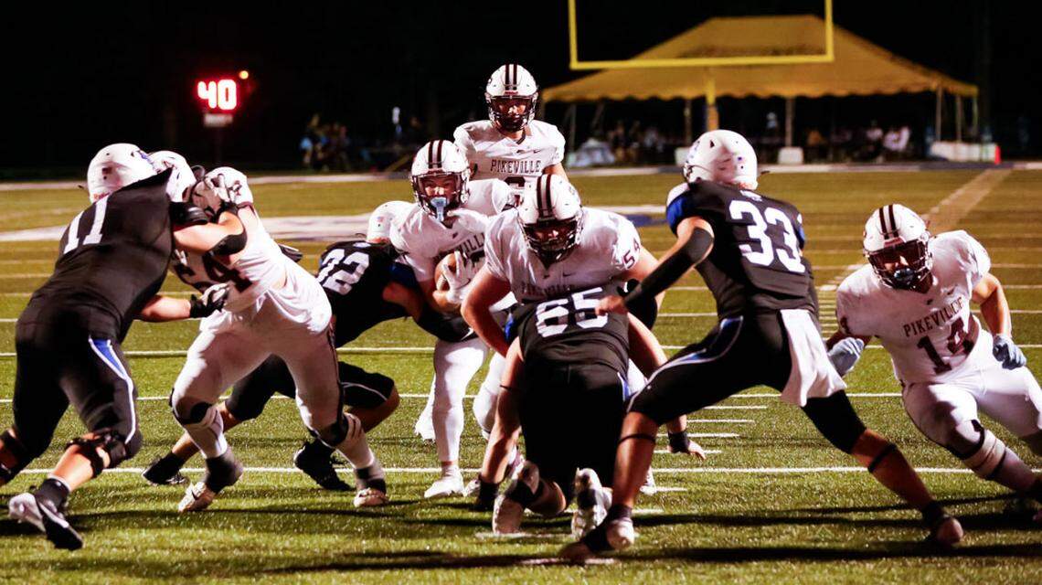 Lexington Christian’s Thomas Sizemore, 32, gets the first hit on Pikeville running back Jayden Justice to halt the Panthers on a fourth-down-and-goal at the 2-yard line in the Eagles’ 40-26 win over Pikeville in the eCampus.com Bowl at Lexington Christian Academy on Friday.