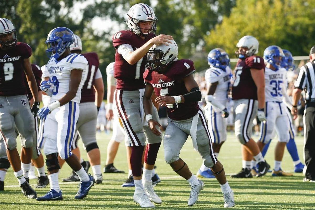 Tates Creek's Cam Workman (10) celebrates a touchdown with Tates Creek's Laron Warner (6) in the second quarter of their game against Henry Clay during the Adidas Kickoff Classic at Tates Creek High School, Friday, Aug. 18. 2017. Tates Creek beat Henry Clay 48-0.