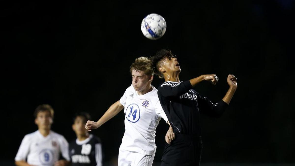 Henry Clay midfielder Clay Beavin and Paul Laurence Dunbar midfielder Pablo Ortiz battle for possession of the ball at Henry Clay High School in Lexington, Ky., on Tuesday, August 29, 2017.