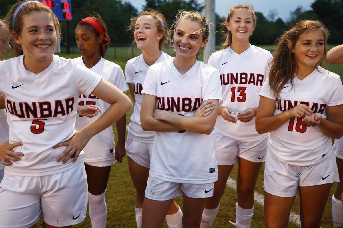 Paul Laurence Dunbar’s Sophia Mitchell, center, joked with teammates before their 43rd District Tournament semifinal soccer game against Tates Creek at Lexington Christian Academy in October. Mitchell played the role of Tracy in “Tragedy Girls” a comedy/horror movie released the same month.