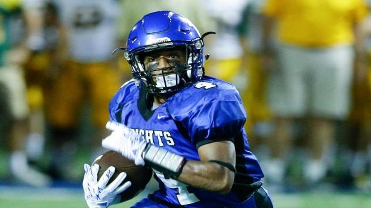 Lexington Catholic's Dameon Jones, pictured here during a touchdown run against St. X in August, led the Knights to a 38-7 win over No. 25 Boyle County on Friday. Jones rushed for 198 yards and a touchdown against the Rebels.