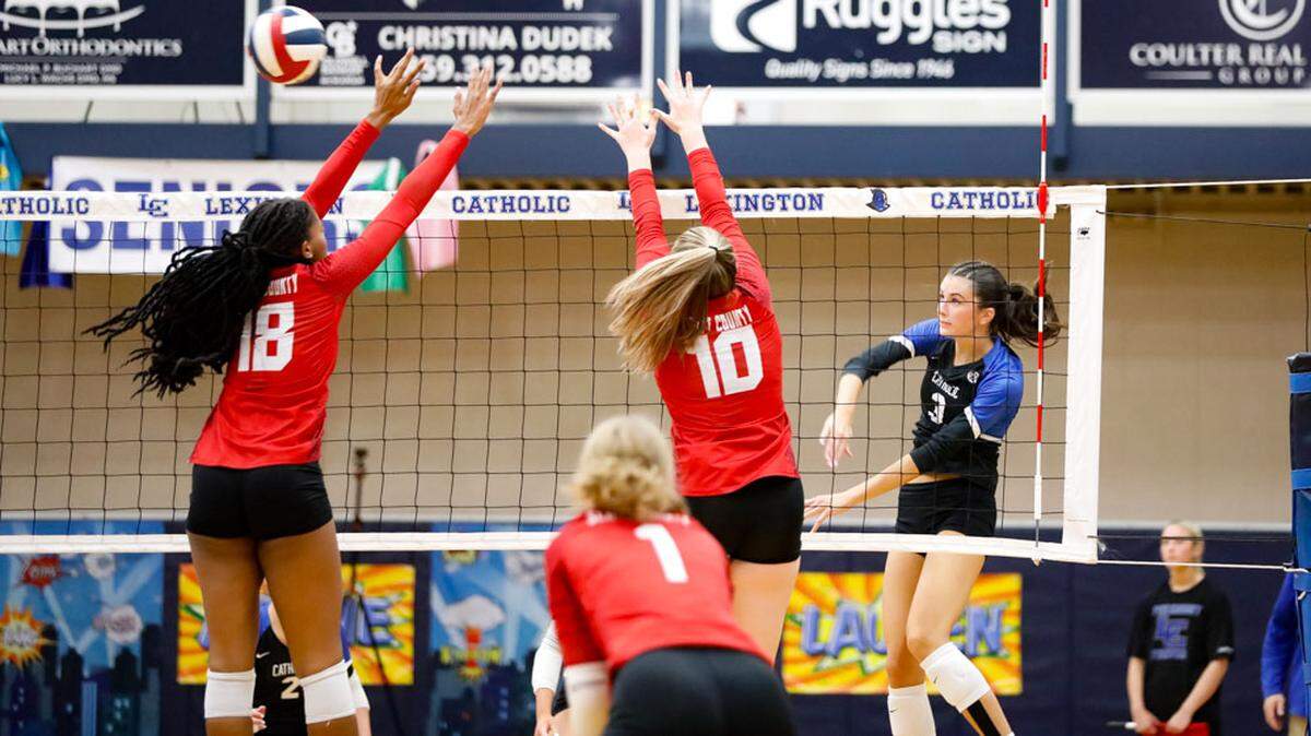 Lexington Catholic senior outside hitter Addie Lowe (3) delivers a kill during the Knights’ sweep over Scott County on Tuesday.