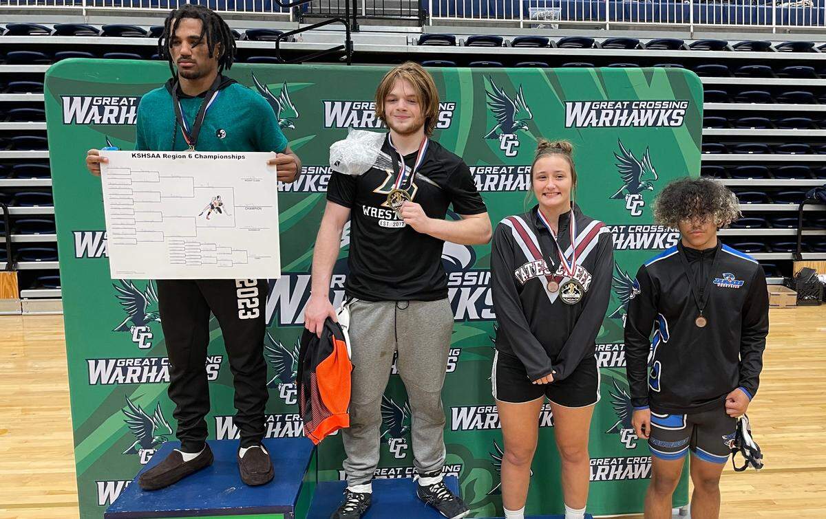 The medalists and state qualifiers from the 165-pound class of the Region 6 championships took the podium at Great Crossing High School on Saturday. From left are winner Malakhi Young of Great Crossing, second-place Landon Worley of Frederick Douglass, third-place Trinity Gottler of Tates Creek and fourth-place Zech Rainey of East Jessamine.